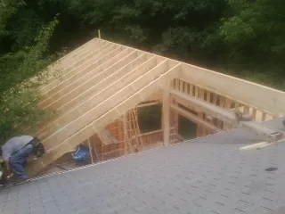 Framing a new roof addition that ties into an existing shingle roof in Patterson